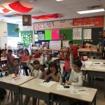 St. Isadores' Kids Run Ottawa Club pose in their classroom