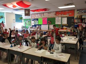 St. Isadores' Kids Run Ottawa Club pose in their classroom