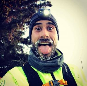 Andrew Paterson gears up with a hat, neck warmer and headlamp for his winter runs