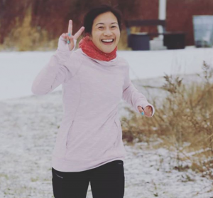 A smiling and laughing Lisa Sun gets takes on another winter run