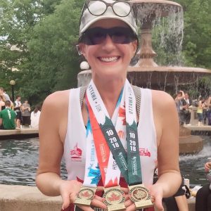 Lorena MacKenzie shows off her Tamarack Ottawa Race Weekend 2019 medals